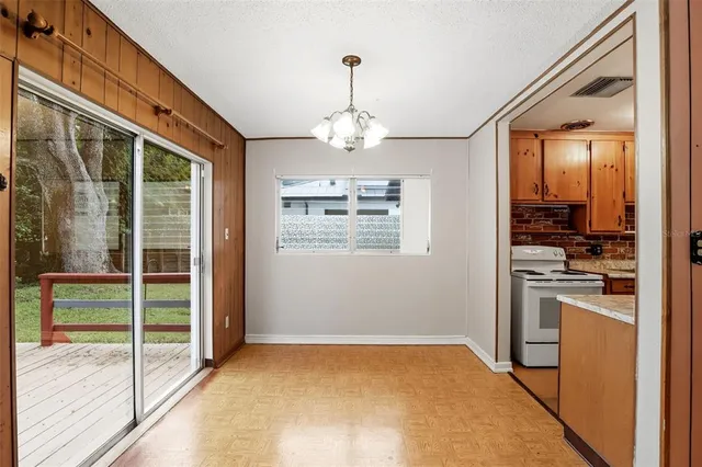 a view of a kitchen with a sink and windows