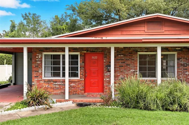 front view of a house with a yard