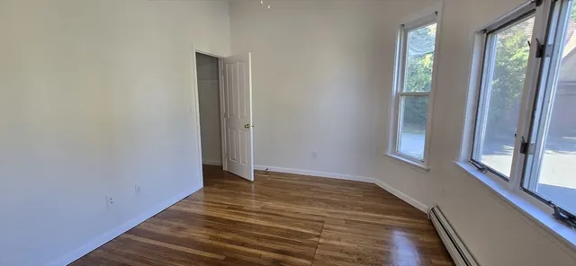 a view of balcony with wooden floor