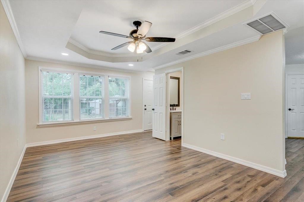 3702 Travis Drive Beaumont, TX 77708 - Photo 15 of 28 a view of an empty room with wooden floor and a window