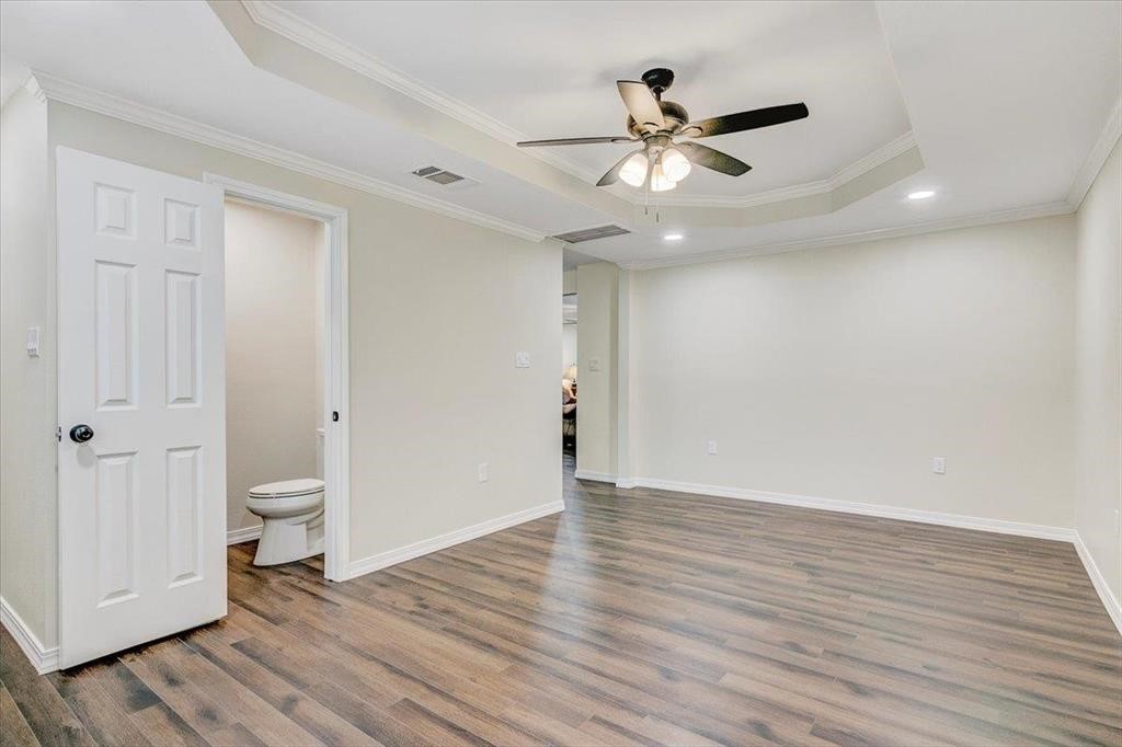 3702 Travis Drive Beaumont, TX 77708 - Photo 16 of 28 a view of an empty room and wooden floor