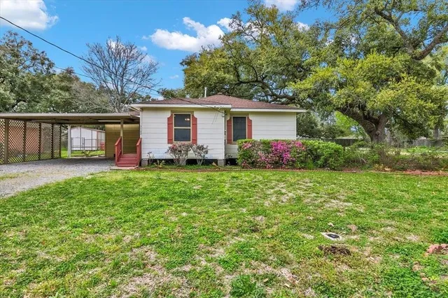 front view of a house with a yard