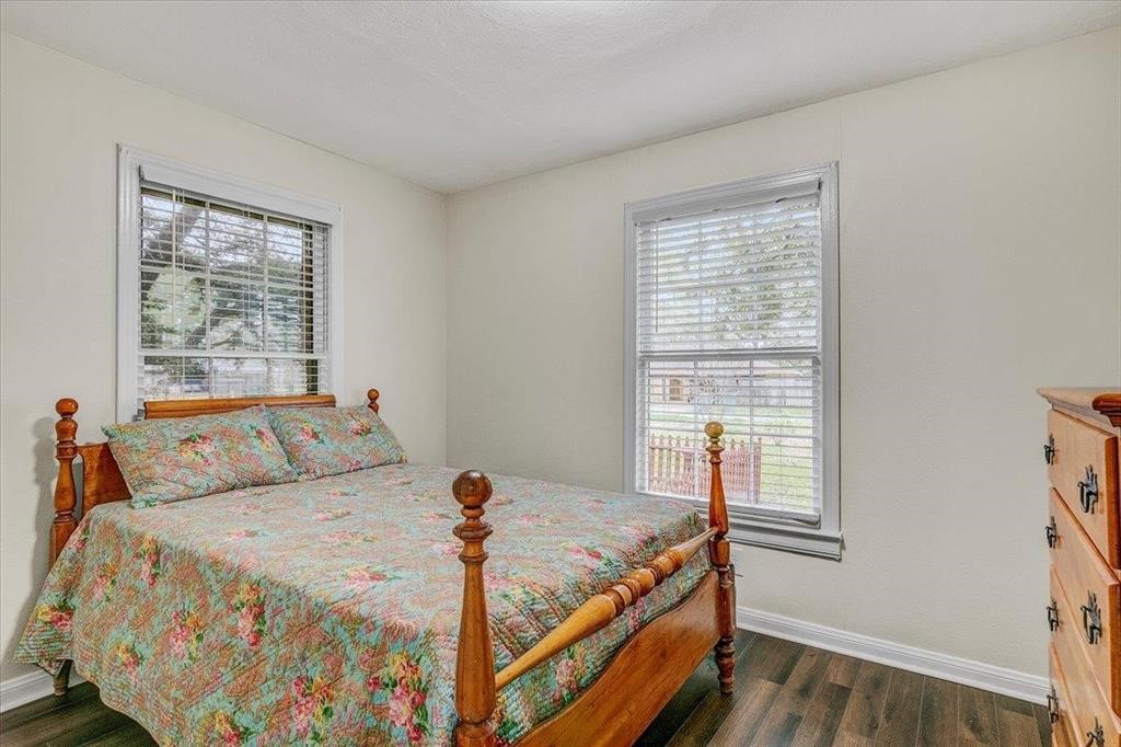 3702 Travis Drive Beaumont, TX 77708 - Photo 21 of 28 a bed sitting in a bedroom next to a window
