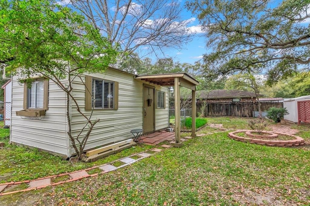 3702 Travis Drive Beaumont, TX 77708 - Photo 24 of 28 a view of a house with backyard