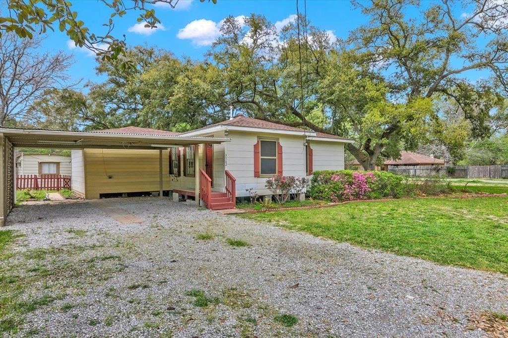 3702 Travis Drive Beaumont, TX 77708 - Photo 3 of 28 a view of a house with a backyard