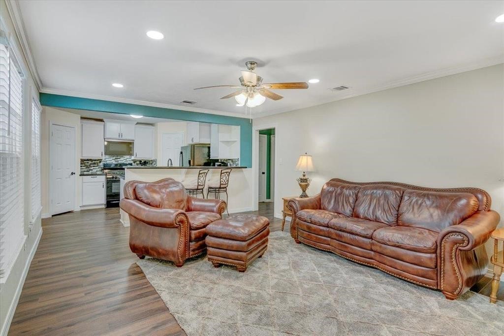 3702 Travis Drive Beaumont, TX 77708 - Photo 7 of 28 a living room with furniture and a chandelier