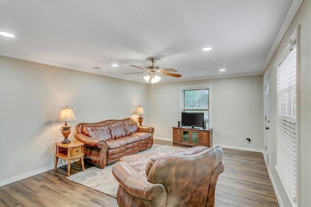 3702 Travis Drive Beaumont, TX 77708 - Photo 8 of 28 a living room with furniture and a flat screen tv