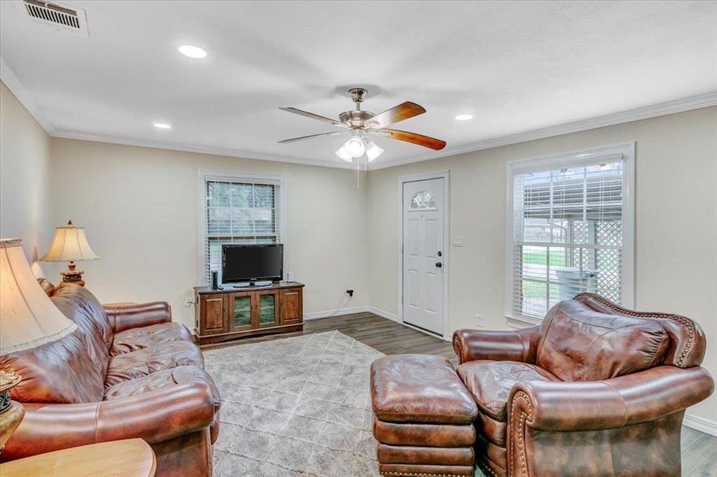 3702 Travis Drive Beaumont, TX 77708 - Photo 9 of 28 a living room with furniture and a flat screen tv