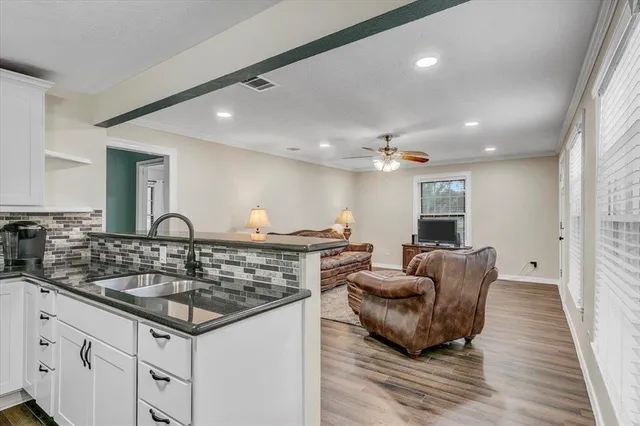 a kitchen with cabinets and stainless steel appliances