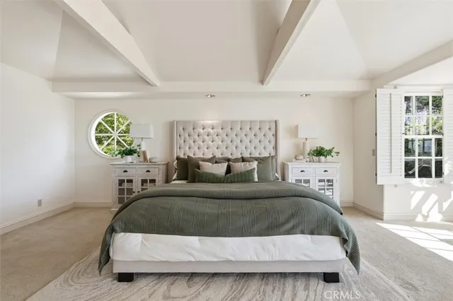 a living room with furniture and windows