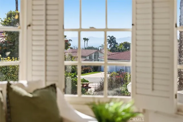 a living room with furniture and windows