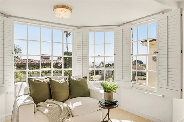 a bathroom with a granite countertop sink a toilet and a shower