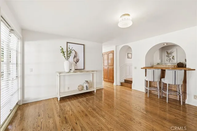 a view of a room with a table and a chair