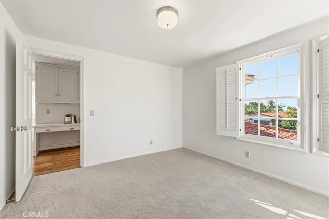 a bathroom with a granite countertop sink a mirror a vanity and a shower