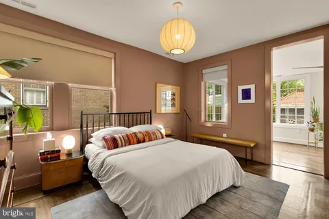 a bedroom with a large bed and a window