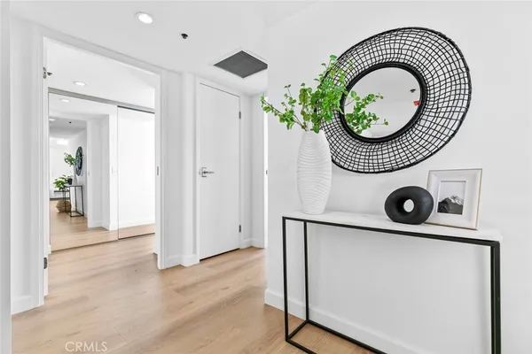 a bedroom with a bed and a potted plant