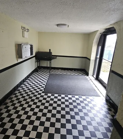 a view of a black and white checkered floor