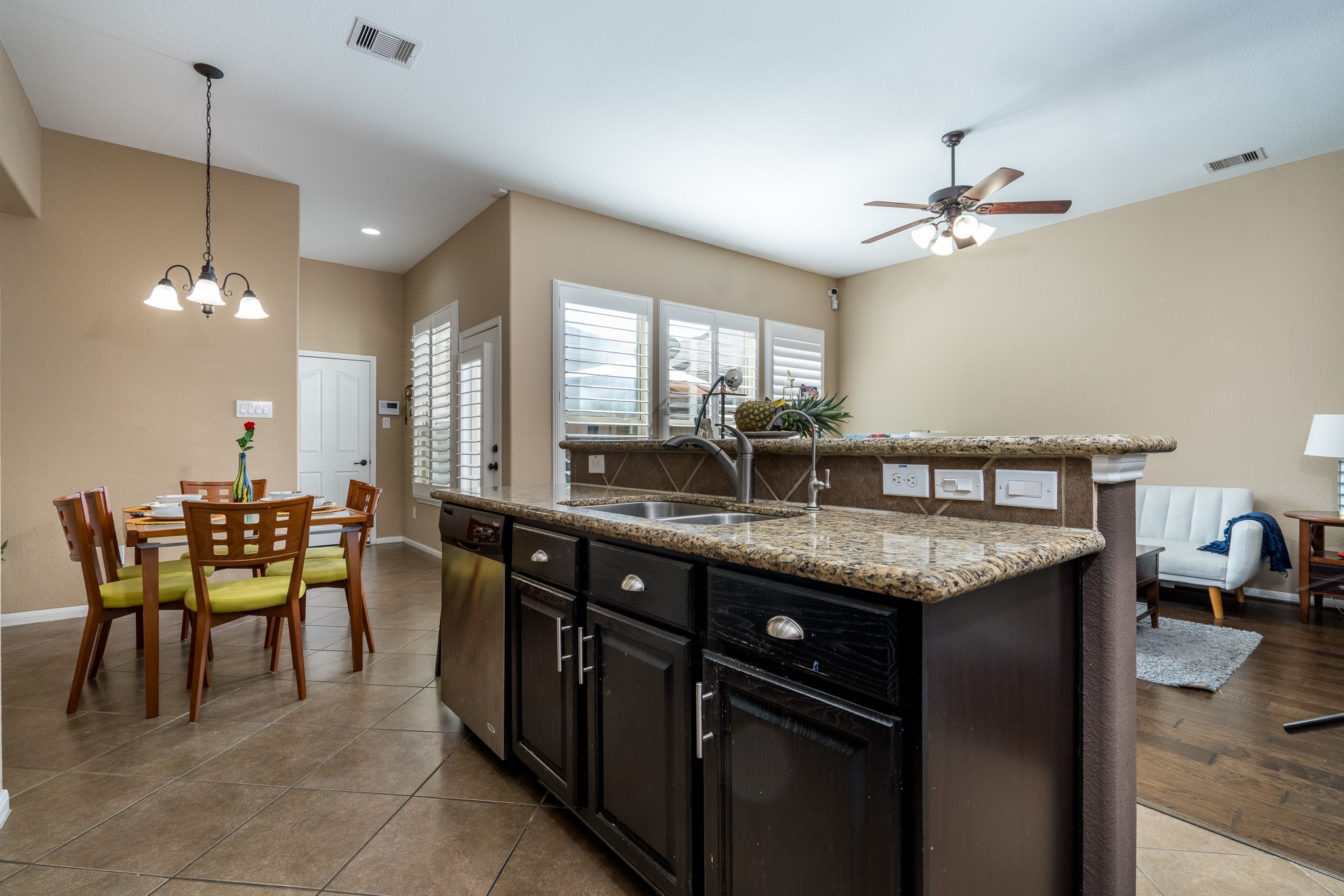 9115 Monarch Mist Lane Houston, TX 77070 - Photo 12 of 26 a kitchen with center island table and chairs in it