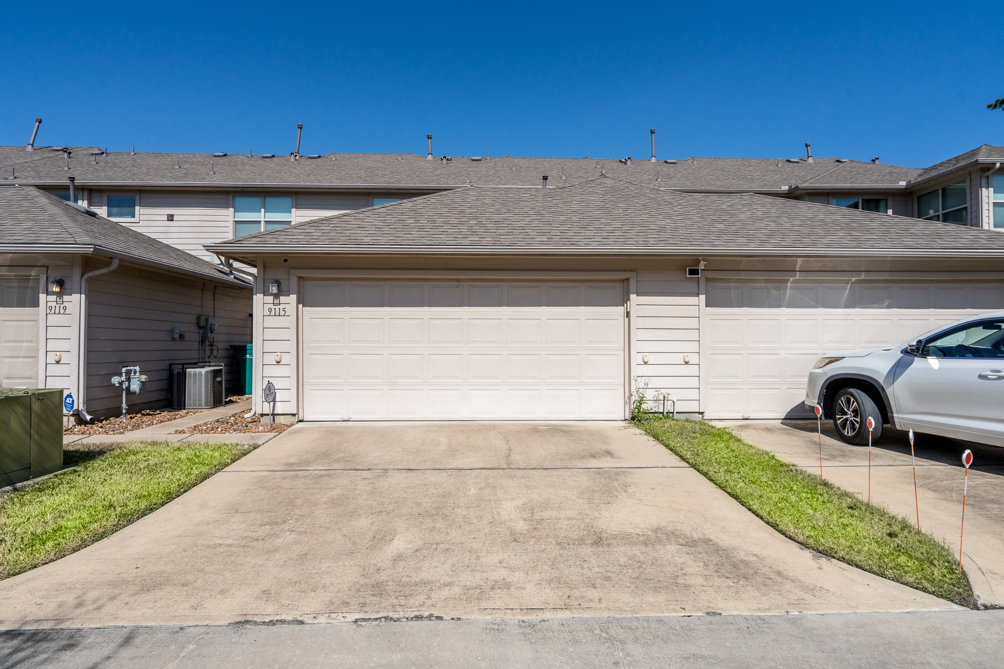 9115 Monarch Mist Lane Houston, TX 77070 - Photo 24 of 26 a view of a car parked in front of a building