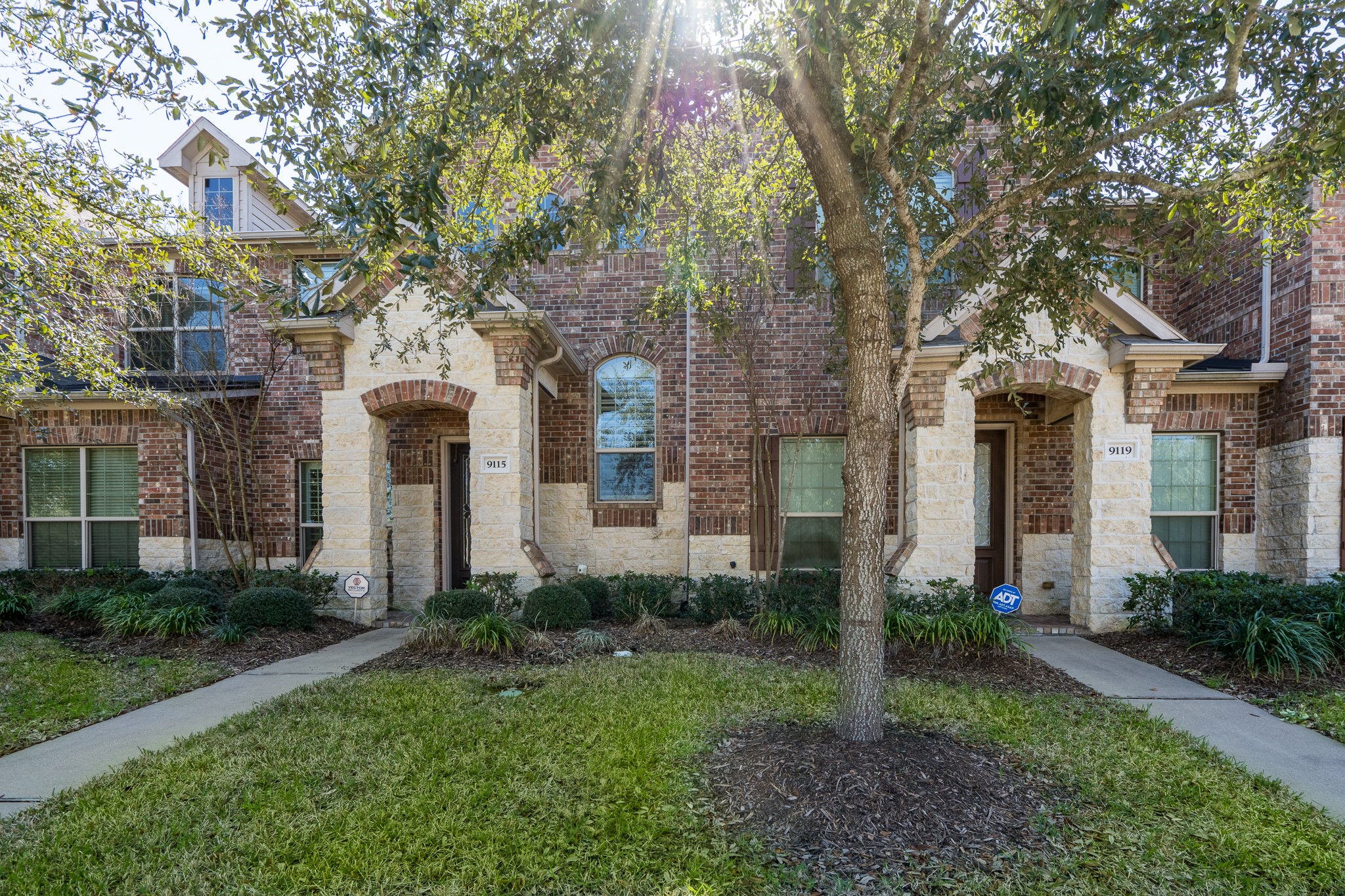 9115 Monarch Mist Lane Houston, TX 77070 - Photo 26 of 26 a front view of a house with garden