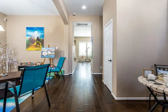 a view of a dining room with furniture and wooden floor