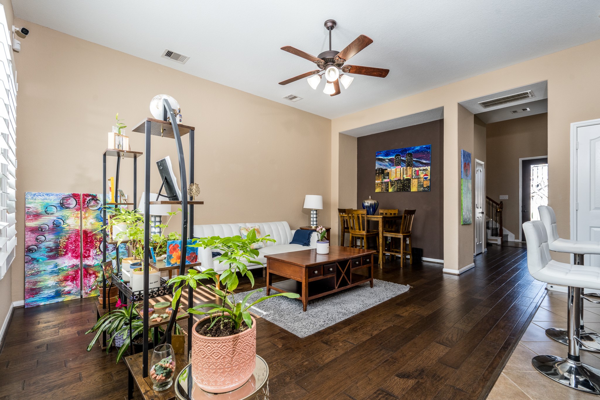 9115 Monarch Mist Lane Houston, TX 77070 - Photo 6 of 26 a living room with furniture and a chandelier