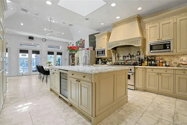 a kitchen with counter top space cabinets and stainless steel appliances