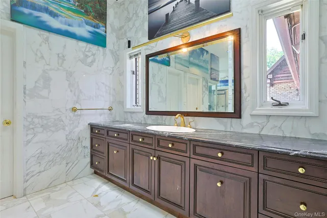 a bathroom with a sink and a mirror