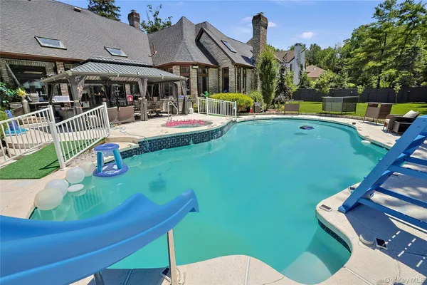a view of a play ground with a swimming pool