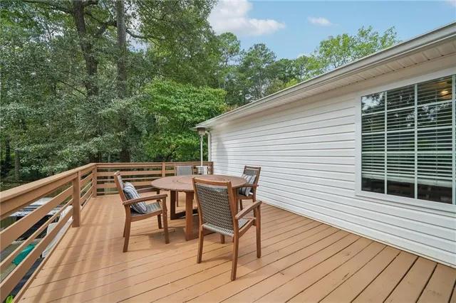 a roof deck with a table and chairs