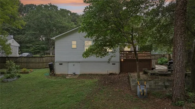 a view of a backyard with sitting area