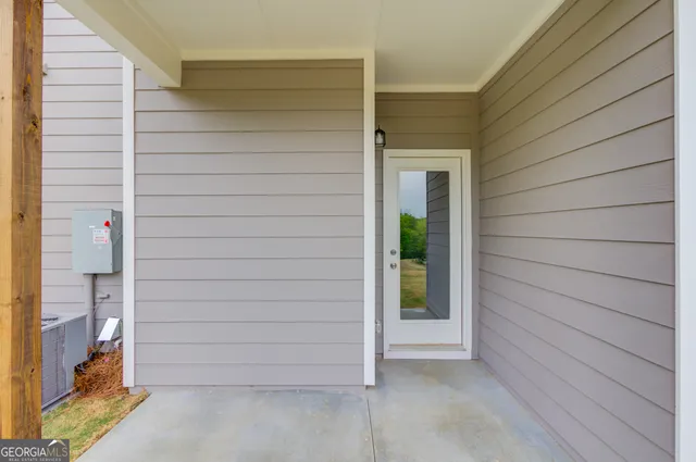 a view of a white building with many windows