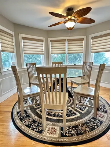 a view of a dining room with furniture window and outside view
