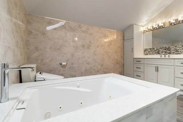 a bathroom with a sink a toilet and a bathtub