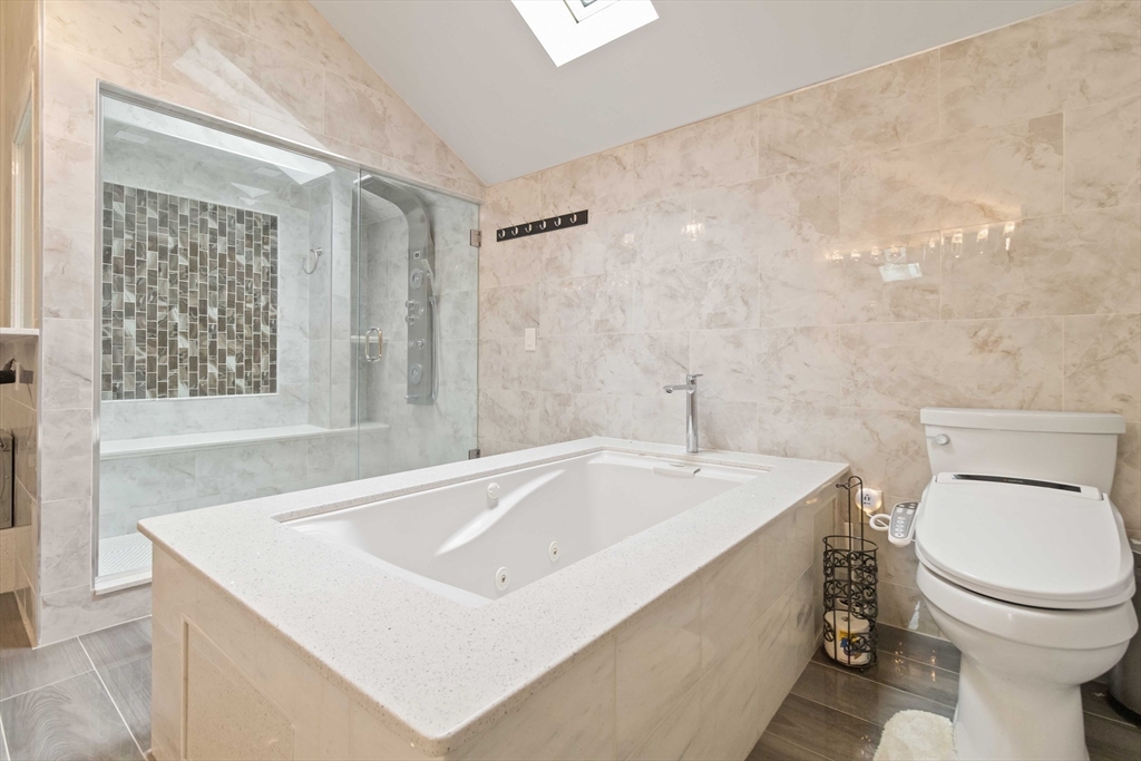 141 Gardiner Road Quincy, MA 02169 - Photo 23 of 39 a bathroom with a sink a toilet and a bathtub