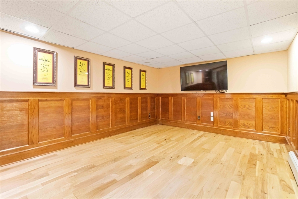 141 Gardiner Road Quincy, MA 02169 - Photo 30 of 39 a view of an empty room with wooden floor and a window