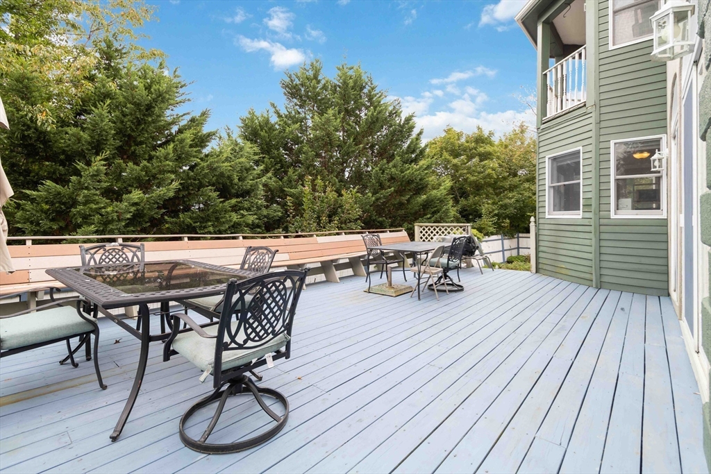 141 Gardiner Road Quincy, MA 02169 - Photo 37 of 39 a view of a dinning table and chairs on roof deck
