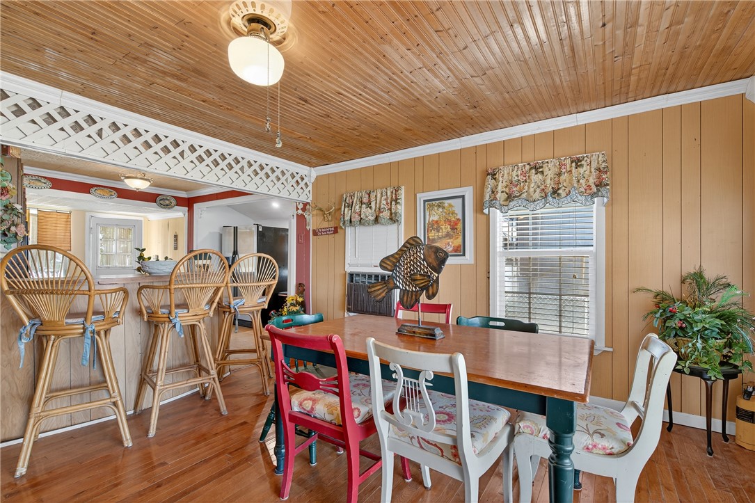107 Lakefield Drive East Mathis, TX 78368 - Photo 12 of 33 a dining room with furniture window and wooden floor