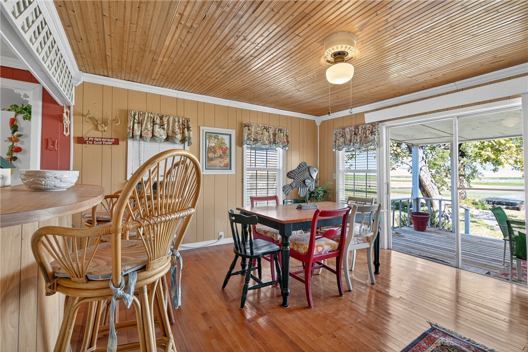 107 Lakefield Drive East Mathis, TX 78368 - Photo 13 of 33 a view of a dining room with furniture window and wooden floor