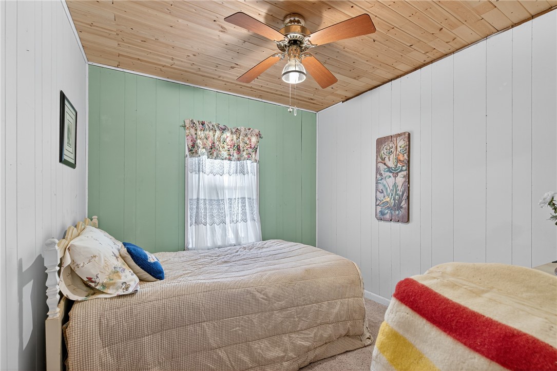 107 Lakefield Drive East Mathis, TX 78368 - Photo 17 of 33 a bedroom with a bed and a window