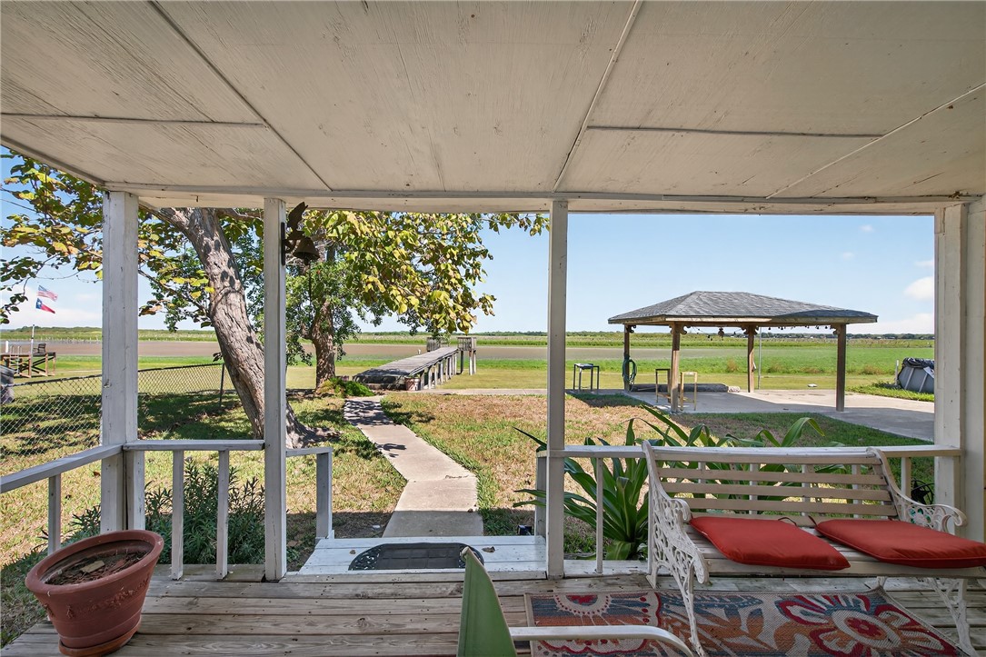 107 Lakefield Drive East Mathis, TX 78368 - Photo 25 of 33 a view of a chairs and table in patio