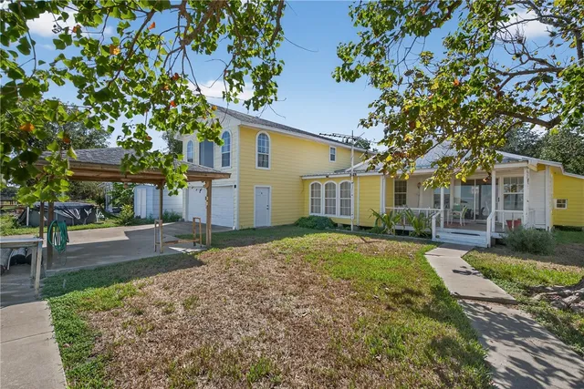 a view of a swimming pool with outdoor seating