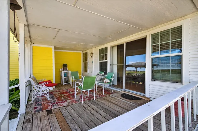 a porch with a seating space