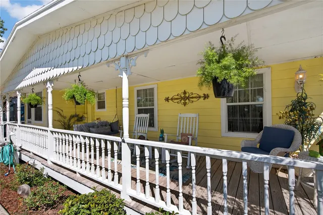 a kitchen with a sink and chairs