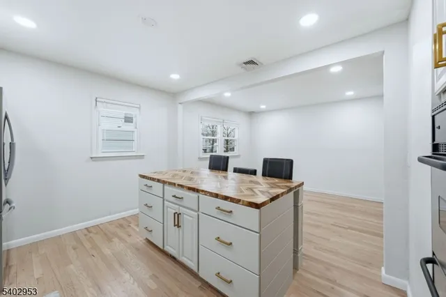 a spacious bedroom with a bed and a table