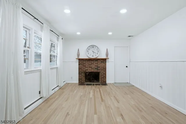 a bathroom with a sink mirror and toilet