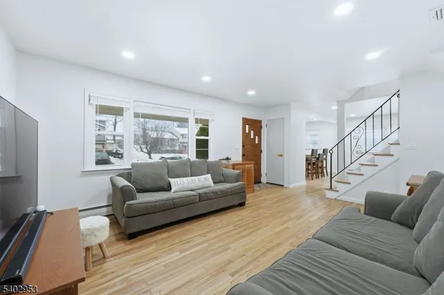 a kitchen with granite countertop a sink stainless steel appliances and cabinets