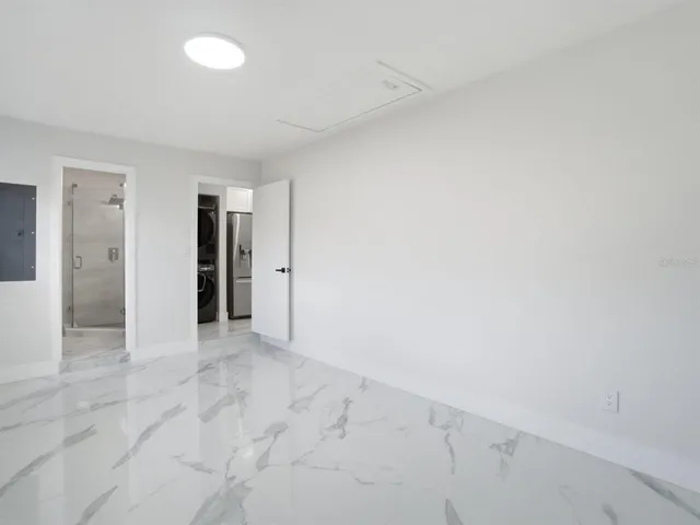 a bathroom with a shower and toilet
