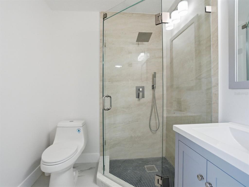 390 Hazel Circle Punta Gorda, FL 33982 - Photo 19 of 44 a bathroom with a shower and toilet