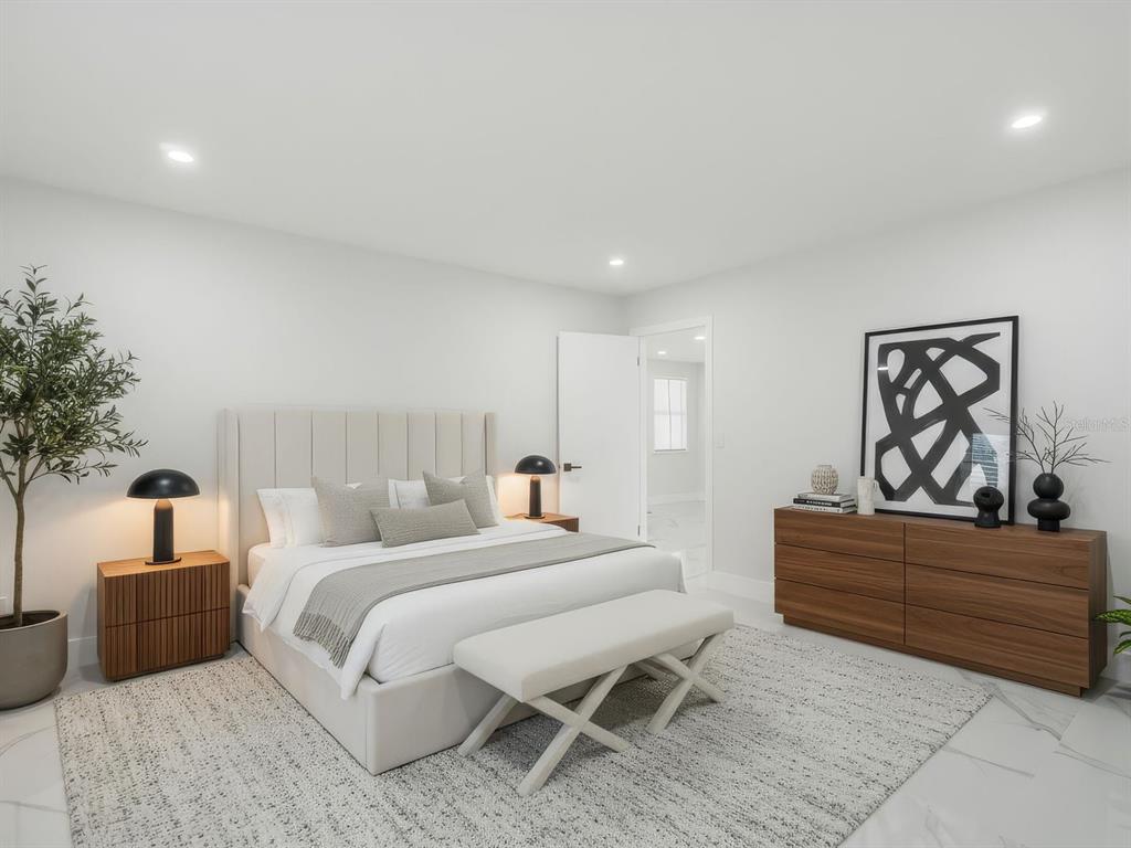 390 Hazel Circle Punta Gorda, FL 33982 - Photo 21 of 44 a bedroom with a bed and a couch